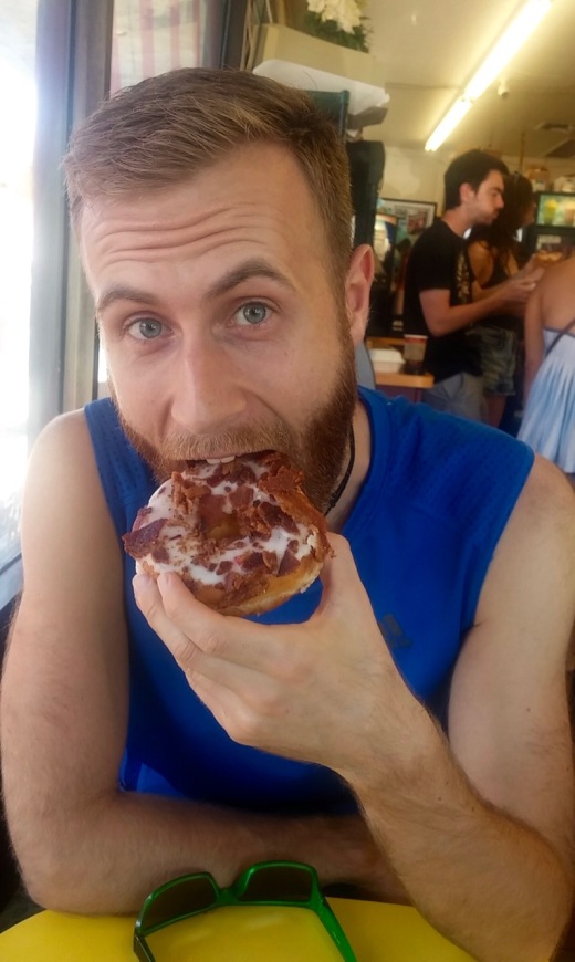 Yes this donut has bacon on top of it.
